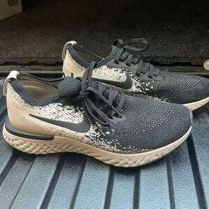 Women’s grey/tan and black Nike running shoes